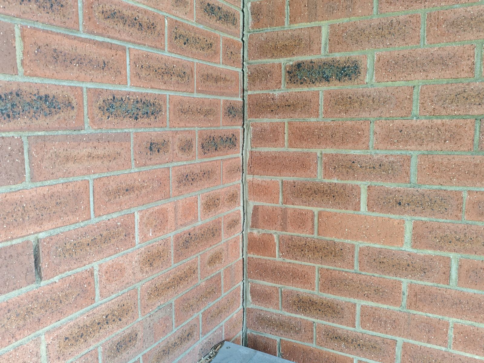 Akaki inspector documenting a structural crack in brickwork during a Perth building inspection