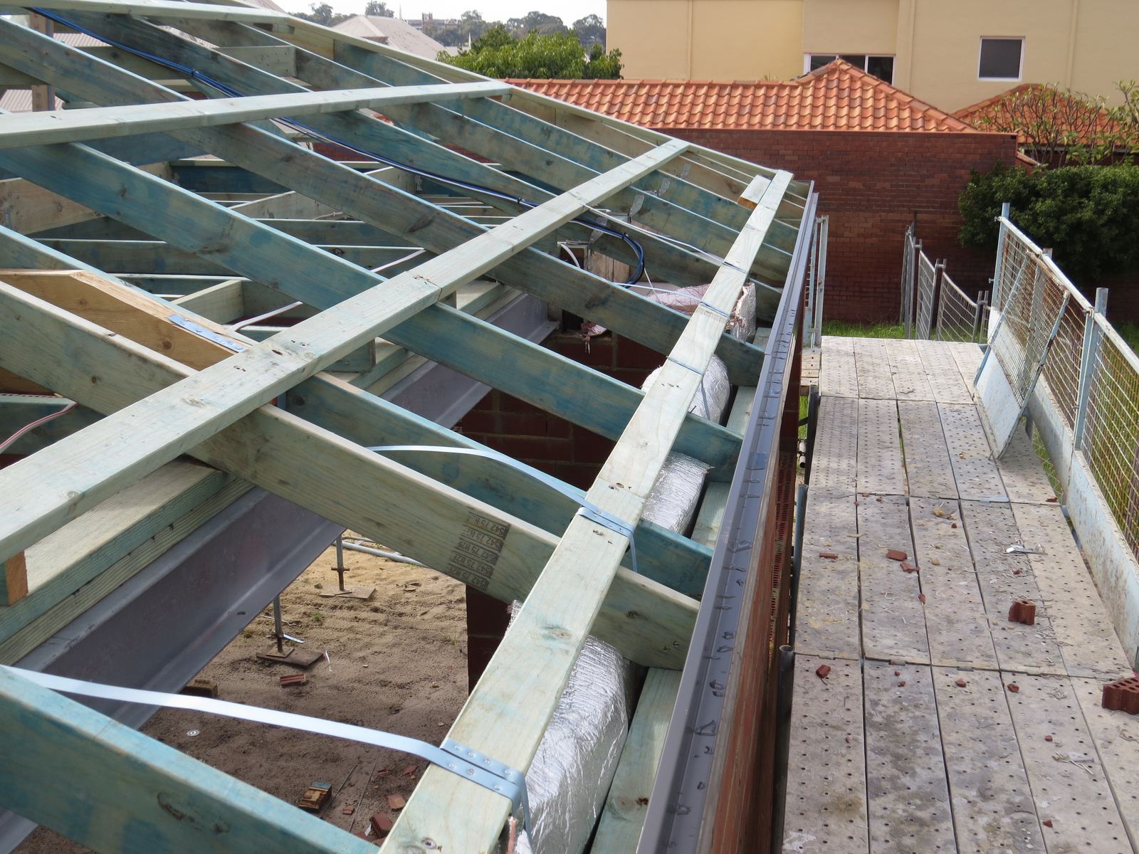 Roof truss frame checked during the frame stage of a building progress inspection