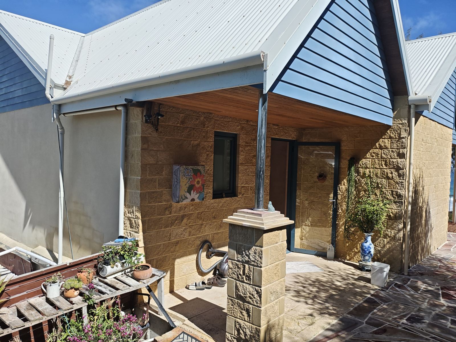 Stone-pillared courtyard entrance on a Perth property inspected by Akaki