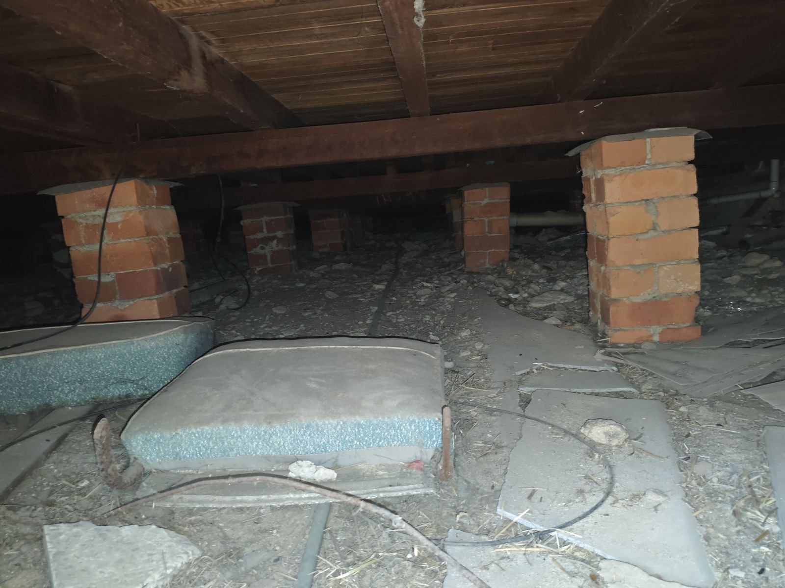 Subfloor inspection showing brick piers and timber bearers during an Akaki building inspection